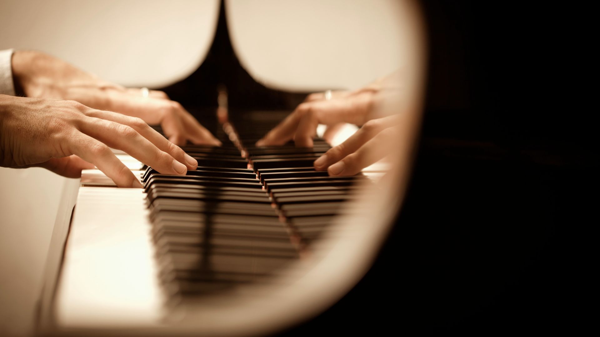 A close up of a person playing a piano